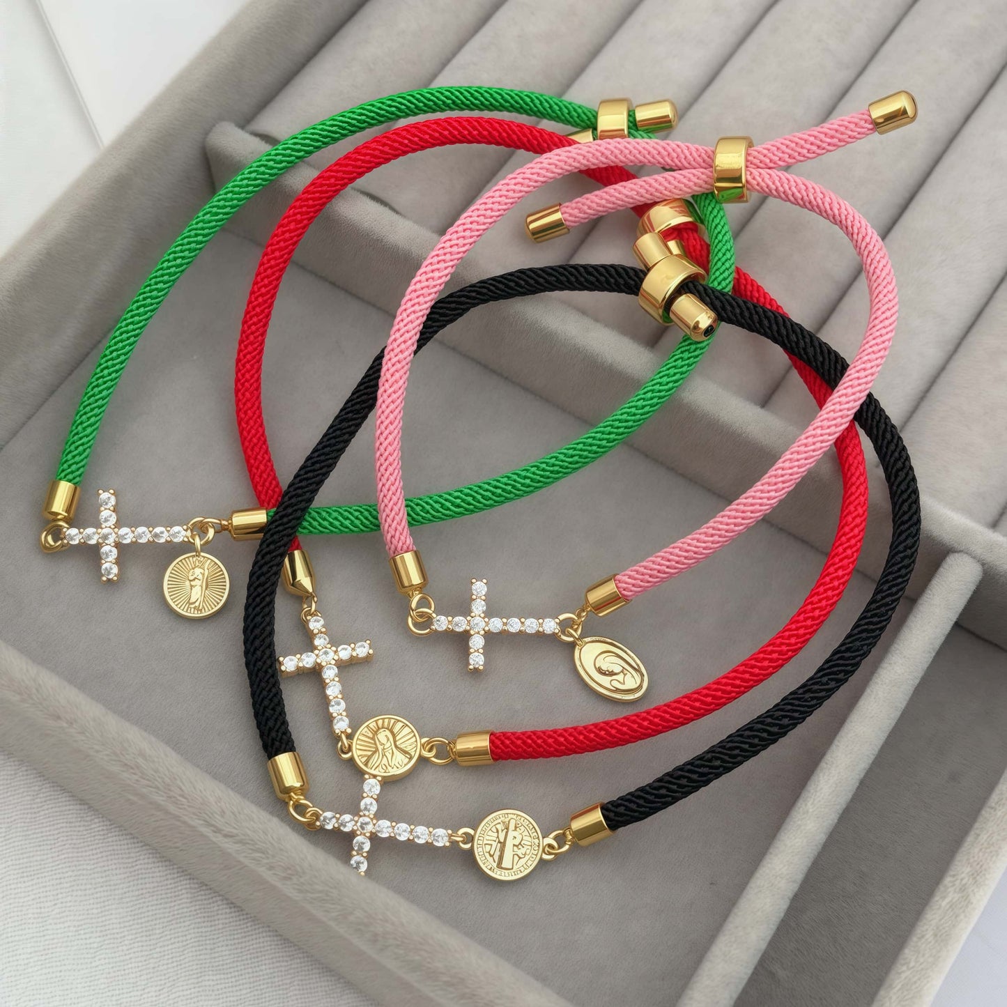 Black bracelet with a zirconia cross and a religious charm of Saint Benedict the Abbot