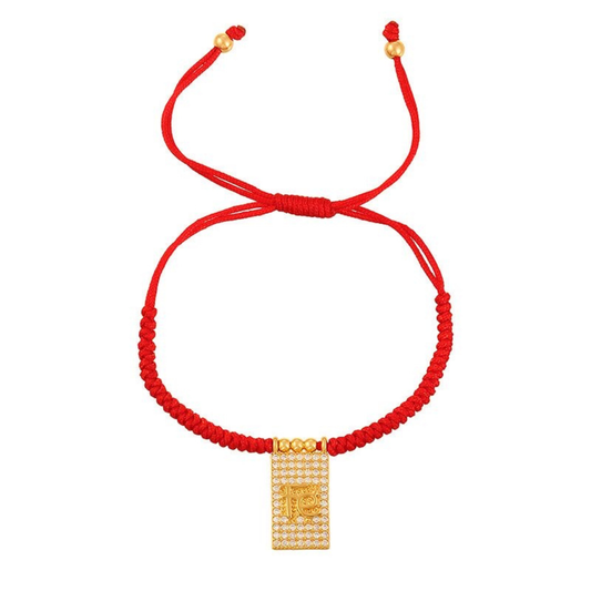 Adjustable red bracelet with gold Faith medal