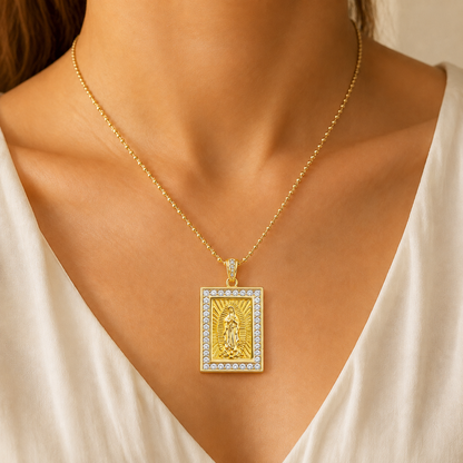 Gold necklace with a sparkly Virgin of Guadalupe medal