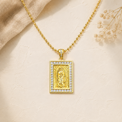 Gold necklace with a sparkly Virgin of Guadalupe medal