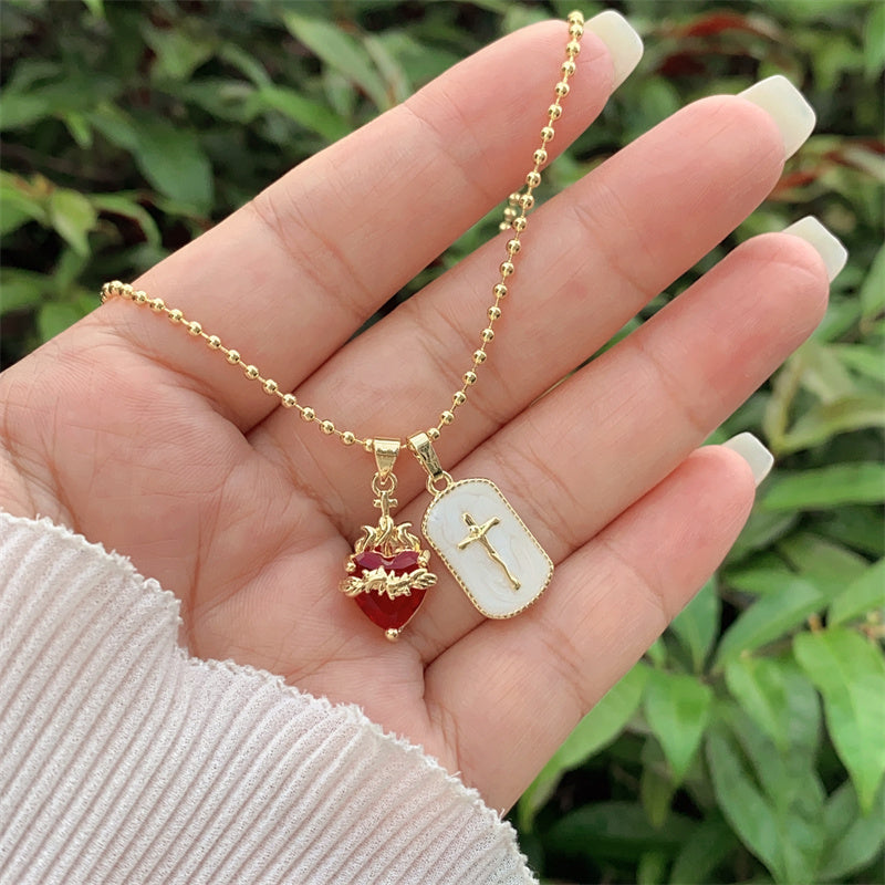 Sacred Heart and cross necklace in gold-plated stainless steel 
