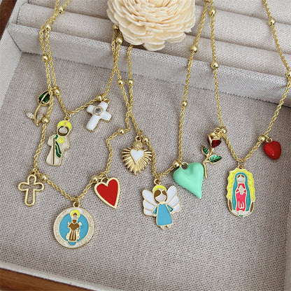 Trendy gold necklace with Saint Francis, cross and red heart