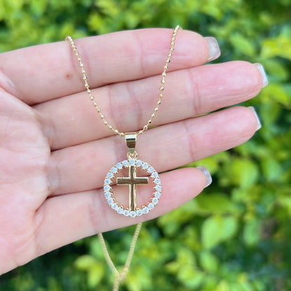 Gold necklace with elegant sparkly circle cross