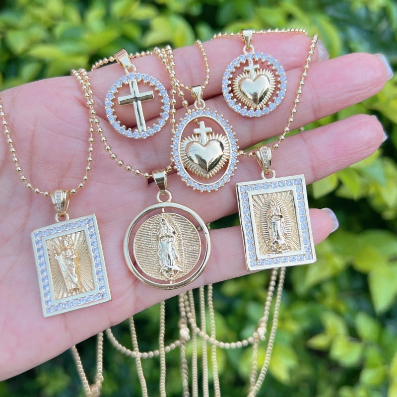 Gold necklace with a sparkly Virgin of Guadalupe medal