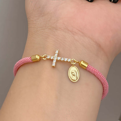 Pink bracelet with a zirconia cross and a religious Virgin Mary charm