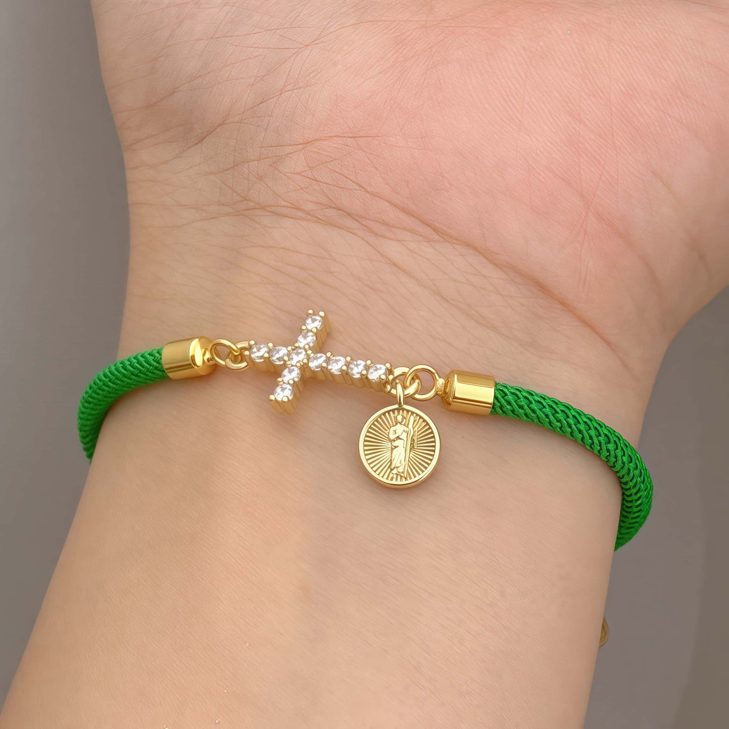 Green bracelet with a zirconia cross and a religious Saint Joseph charm