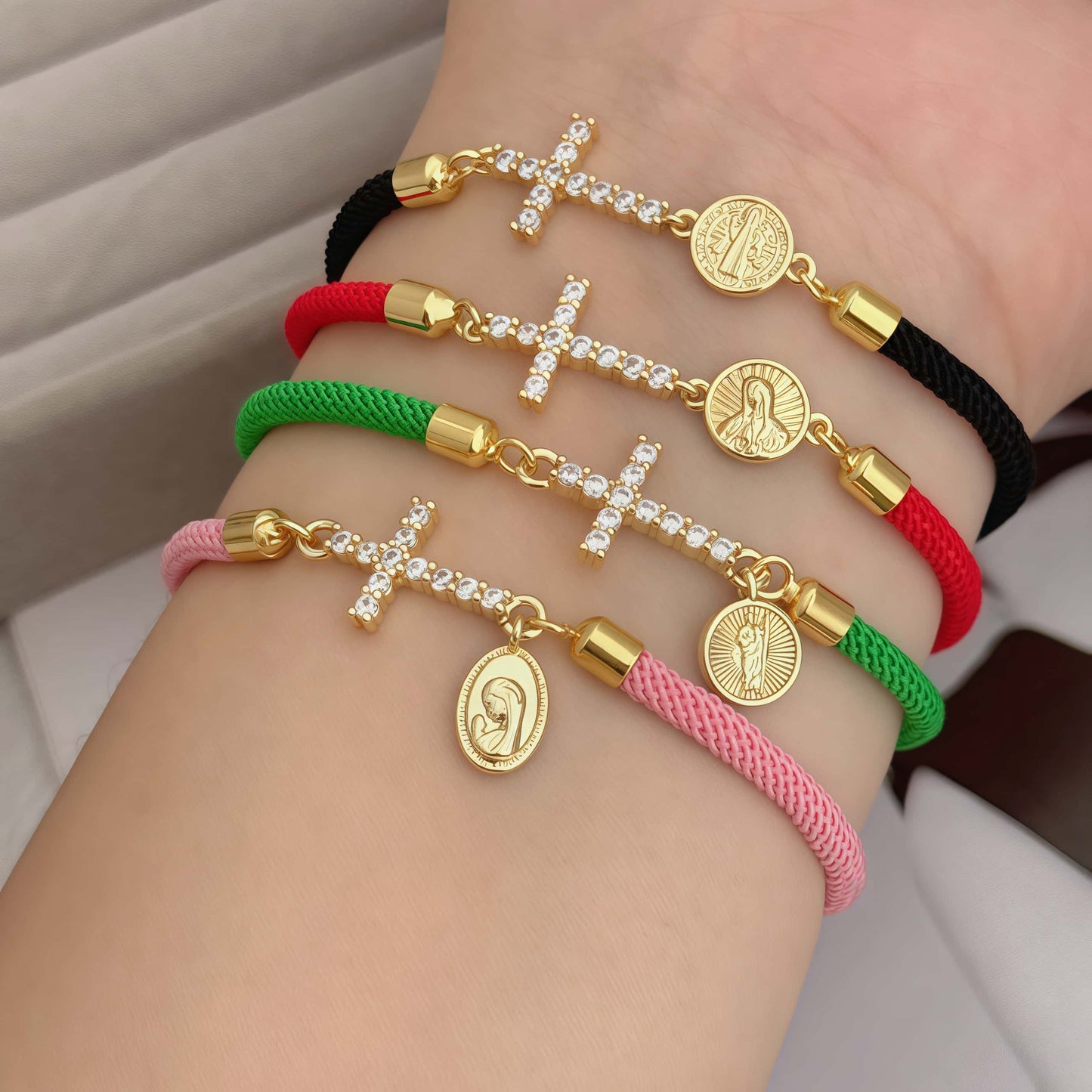 Red bracelet with a zirconia cross and a religious Virgin Mary charm