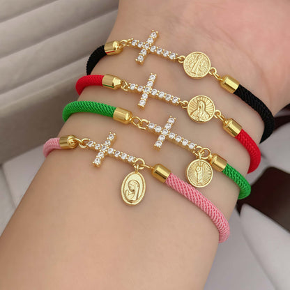 Red bracelet with a zirconia cross and a religious Virgin Mary charm