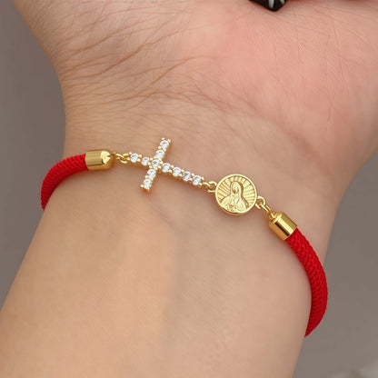 Red bracelet with a zirconia cross and a religious Virgin Mary charm