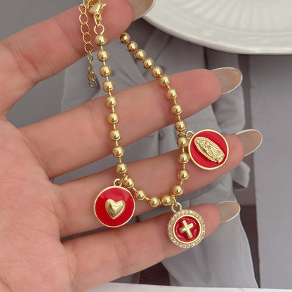 Red woven bracelet with gold pavé charm