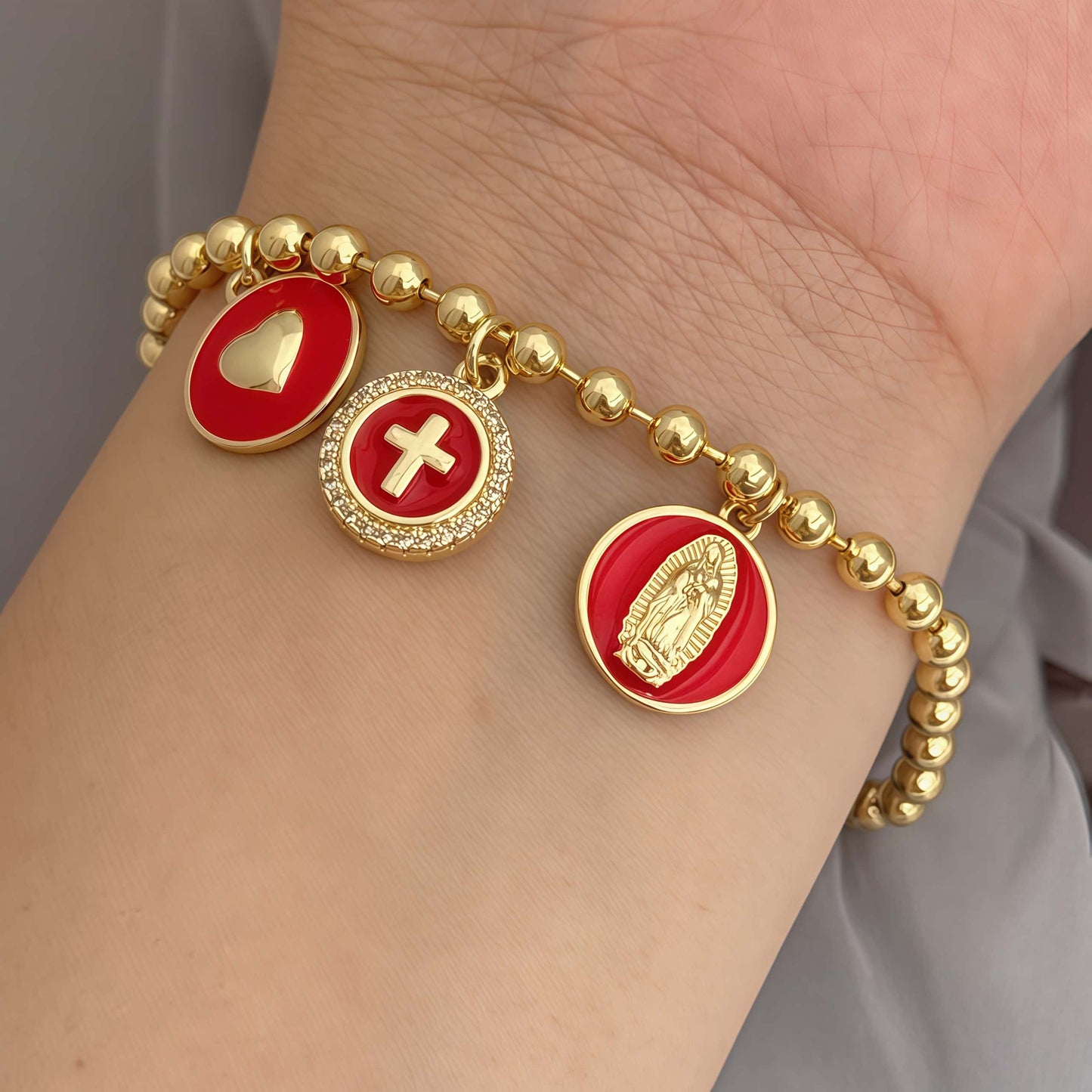 Red woven bracelet with gold pavé charm