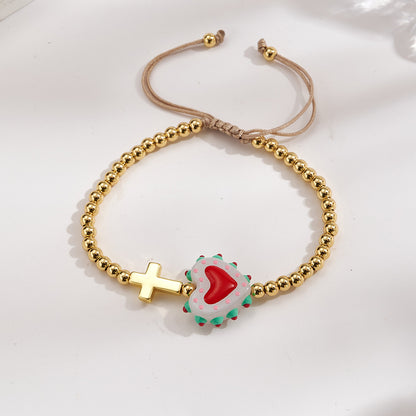 Adjustable bracelet with gold beads, cross and heart, enameled white with red