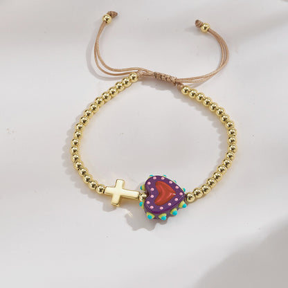 Adjustable bracelet with gold beads, cross and heart, enamelled purple and red