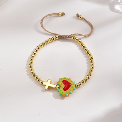 Adjustable bracelet with gold beads, cross and heart, enameled green with red