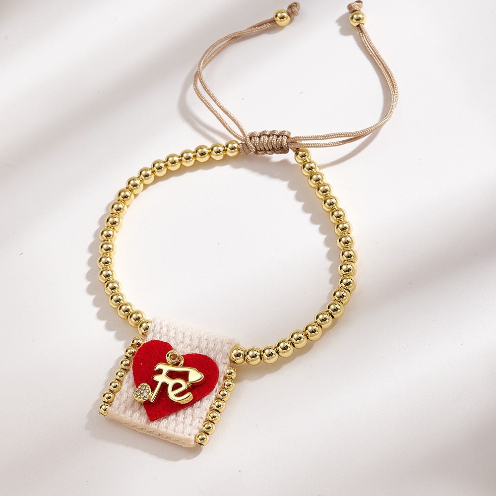 Brazalete ajustable con cuentas doradas y corazón Fe rojo con blanco