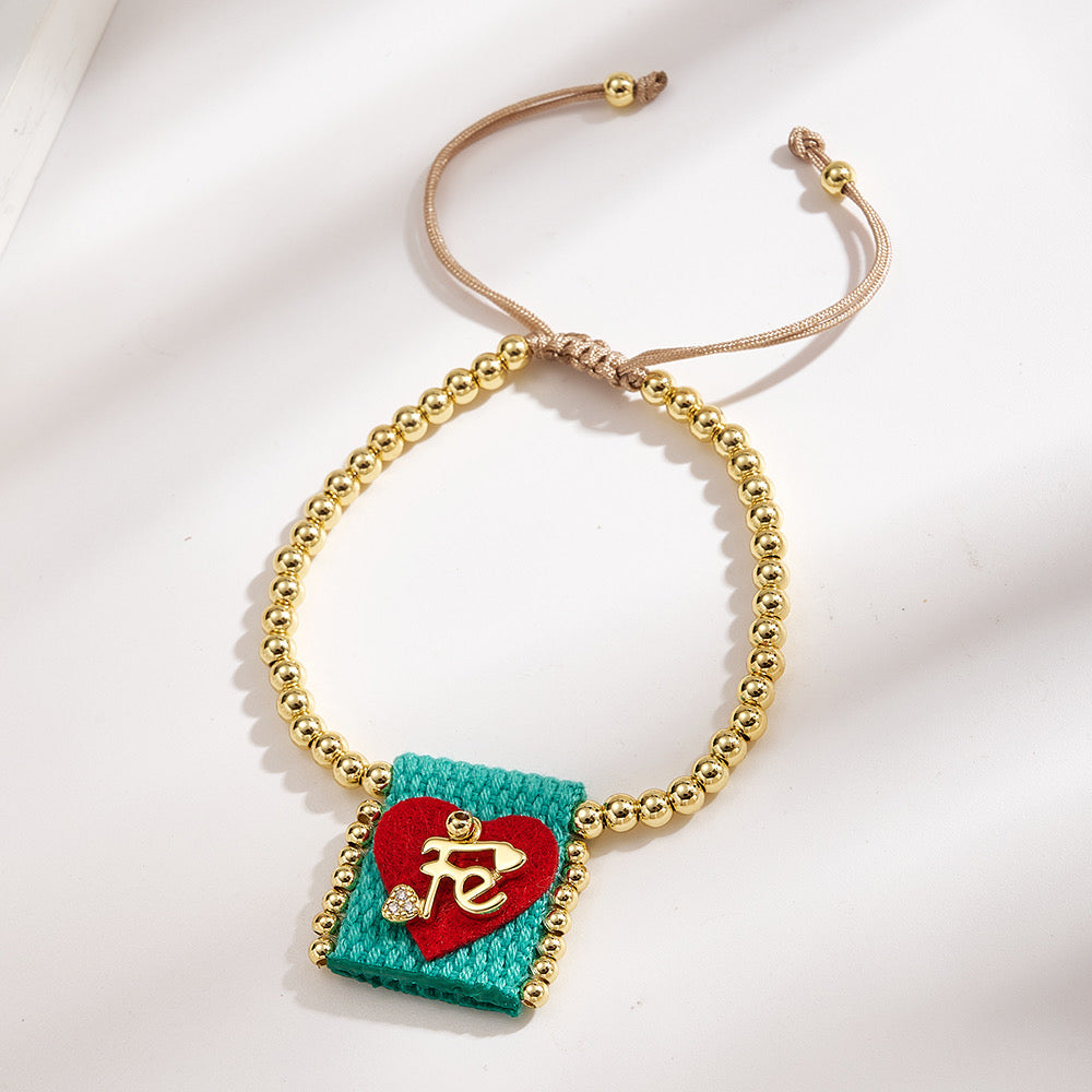 Brazalete ajustable con cuentas doradas y corazón Fe verde