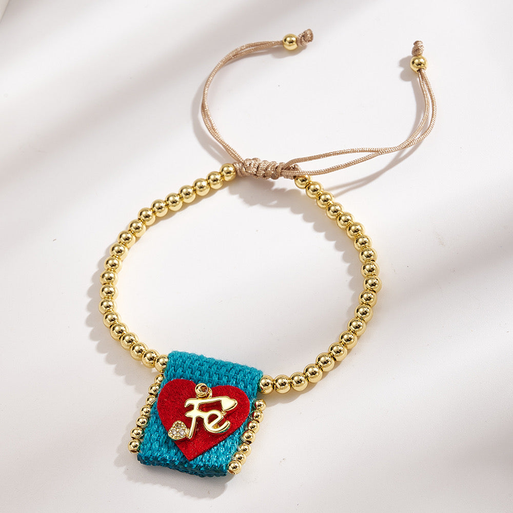 Brazalete ajustable con cuentas doradas y corazón Fe turquesa