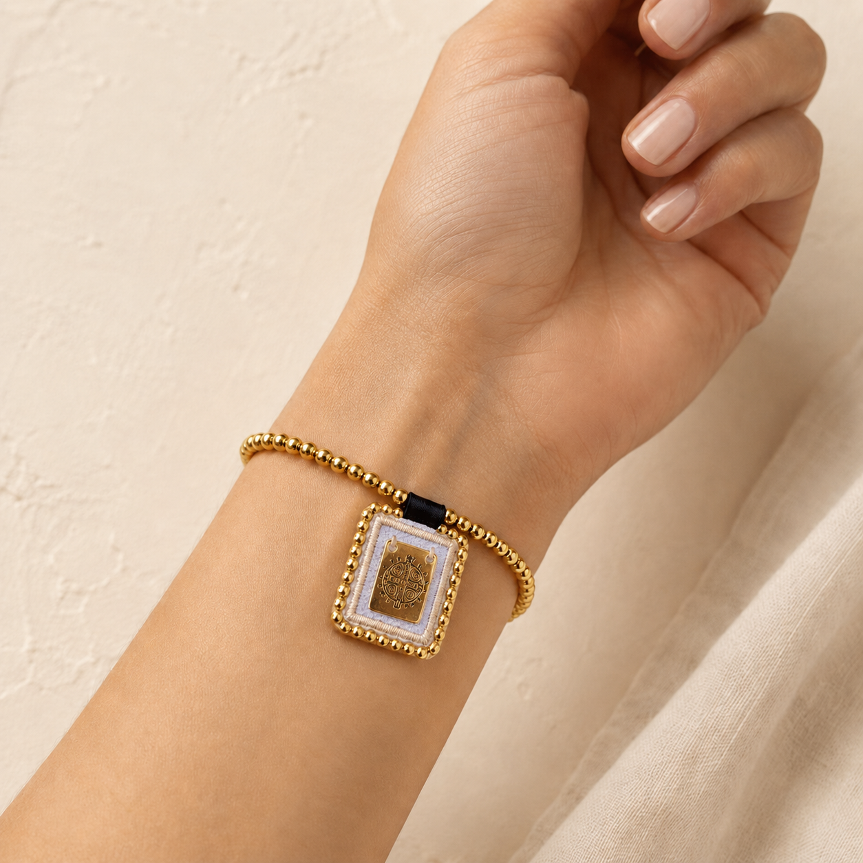 Spiritual bracelet with St. Benedict medal and gold beads