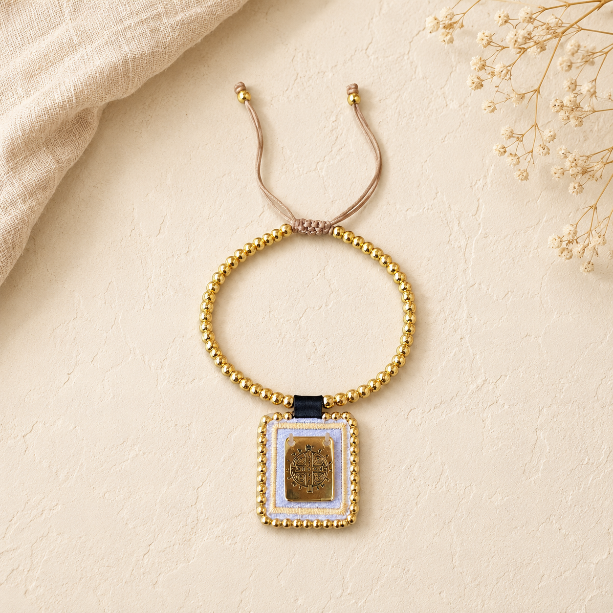 Spiritual bracelet with St. Benedict medal and gold beads