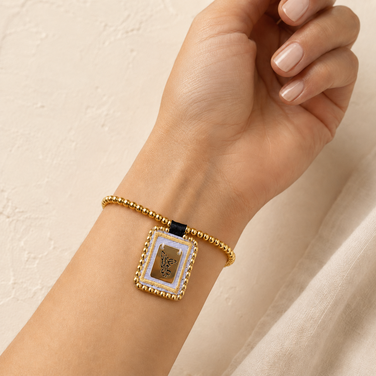 Spiritual bracelet with a medal of Saint Michael the Archangel and gold beads