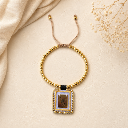Spiritual bracelet with a medal of Saint Michael the Archangel and gold beads