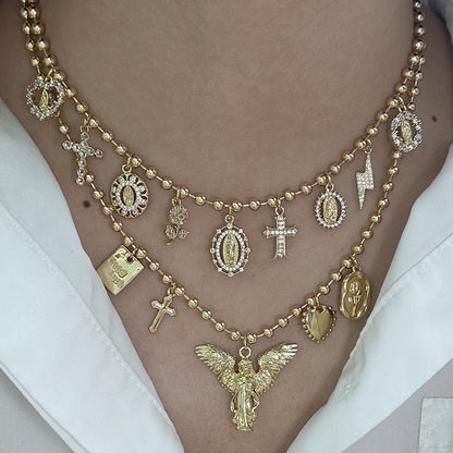 Pulsera religiosa de la Virgen Maria y cruz en acero inoxidable dorado